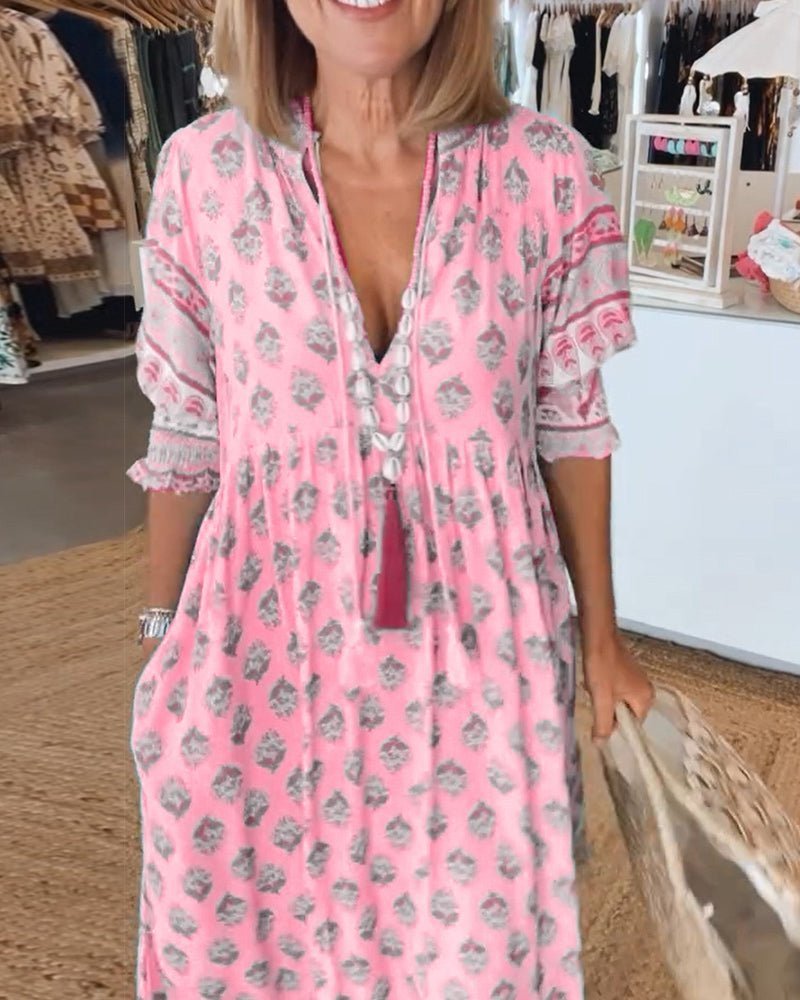 Spring/summer women's floral V-neck dress, chic and flattering midi style.