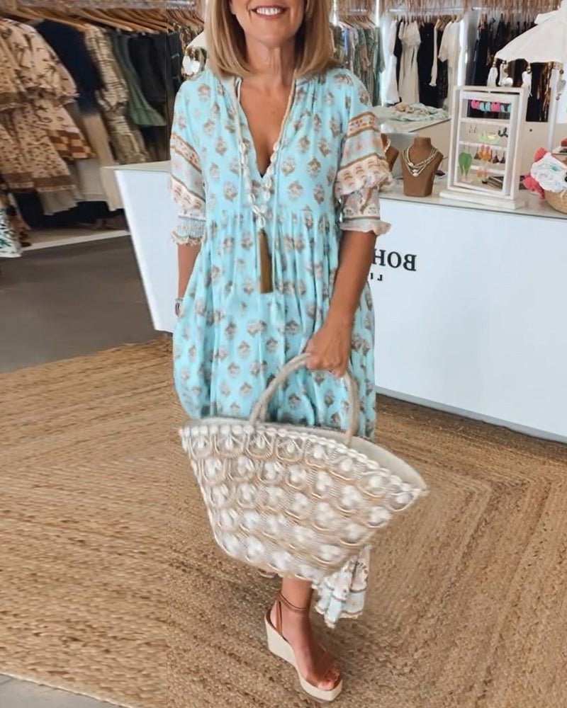 Chic women's floral V-neck dress, flattering silhouette for summer elegance.
