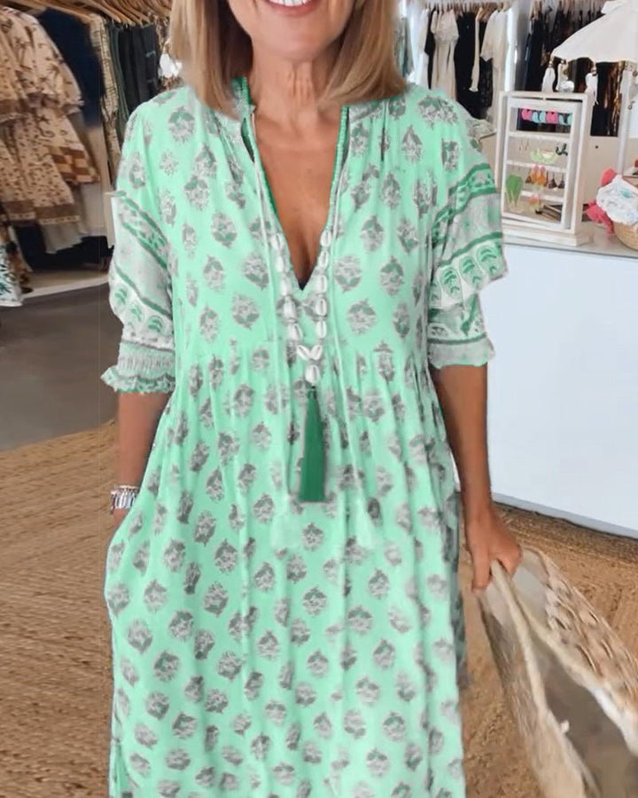 Spring fashion women's V-neck floral dress, flowy and comfortable for elegance.