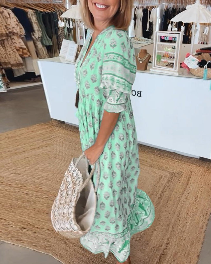 Elegant women's floral V-neck dress, a flowy design for timeless summer fashion.