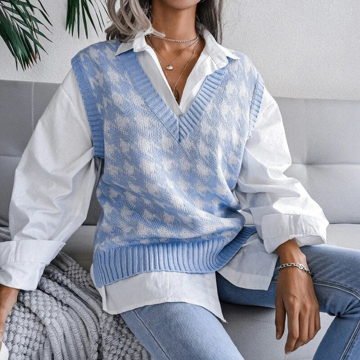 Classic women's houndstooth V-neck knitted vest. A stylish sleeveless layering top for a preppy, chic look.