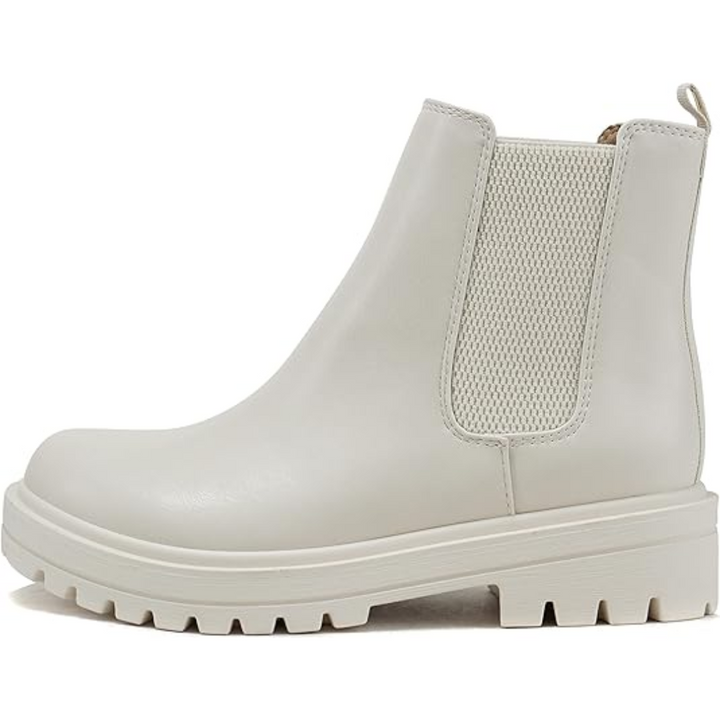 Close-up of the elastic and low heel on women's chic Chelsea ankle boots, comfortable everyday footwear.