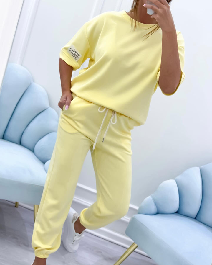 Comfortable women's short sleeve tee and matching flowy pants set. Chic summer two-piece outfit.