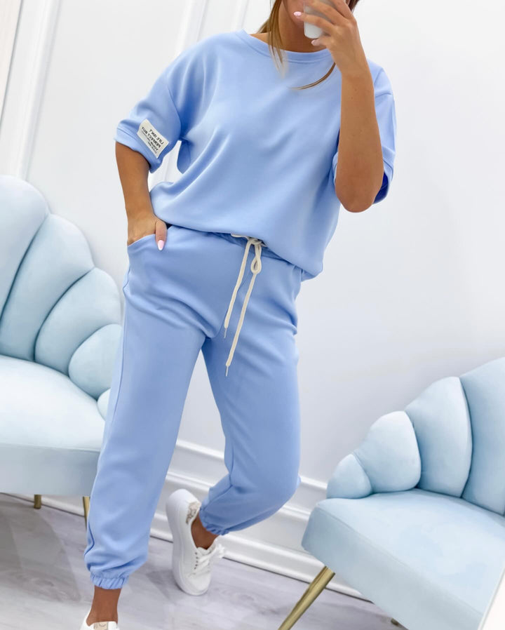 Relaxed fit women's short sleeve top and casual pants set. Stylish and comfy for home or errands.