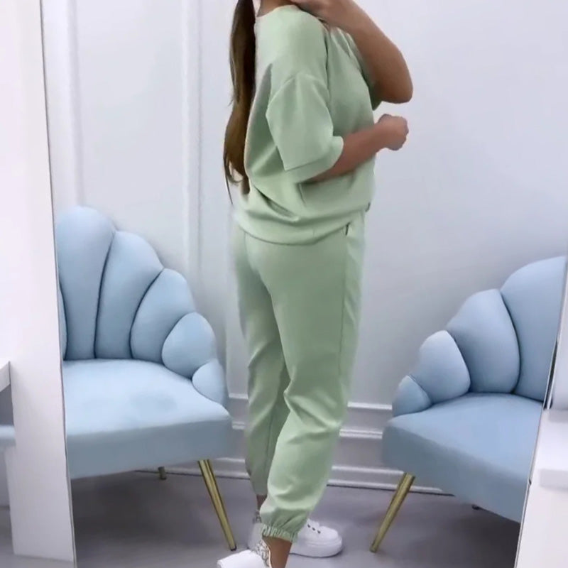 Two-piece women's short sleeve top and pants set for summer. Relaxed, fashionable, and breathable.