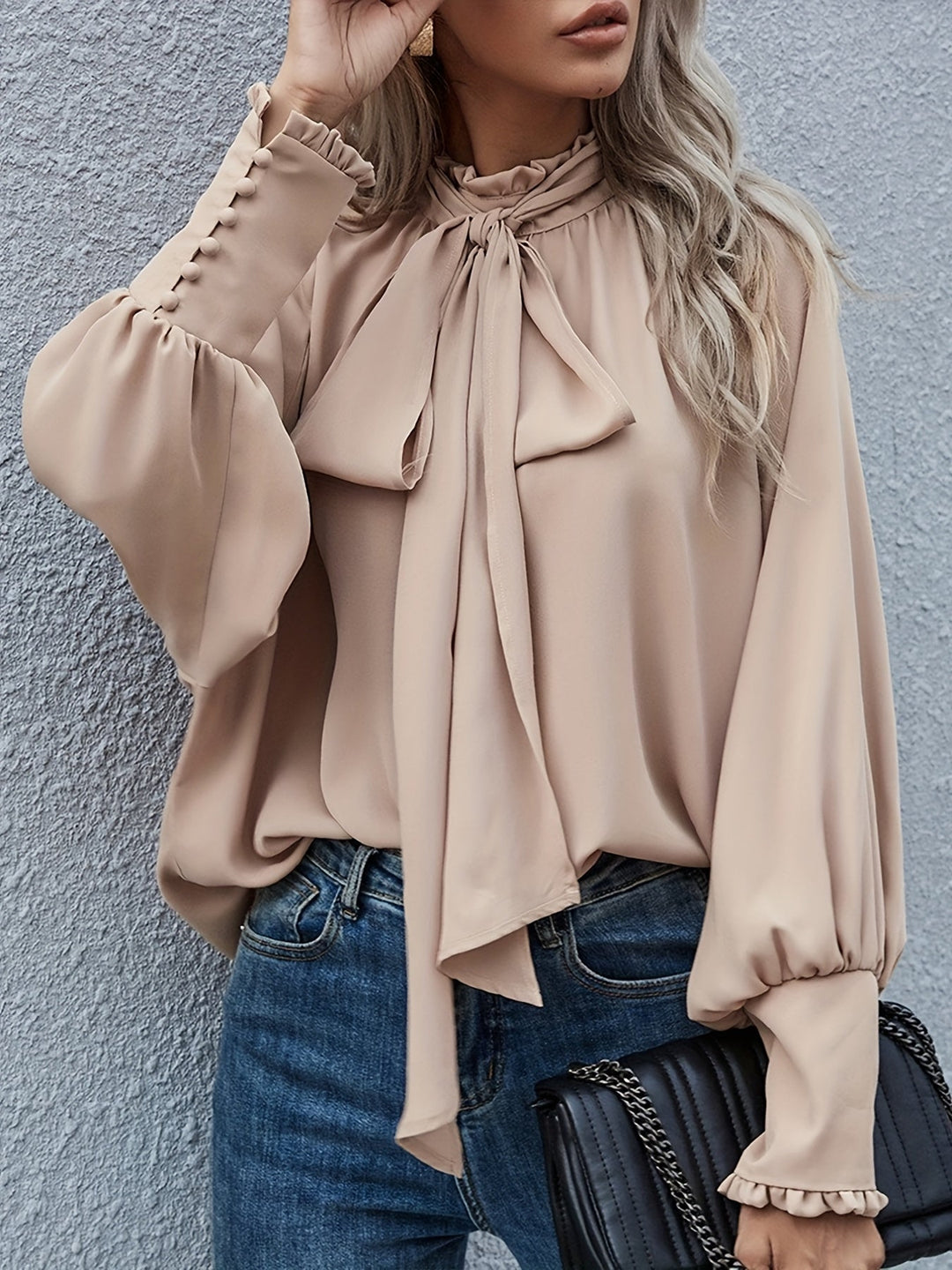 Chic women's long sleeve blouse with tie-neck design for effortless style and comfort.