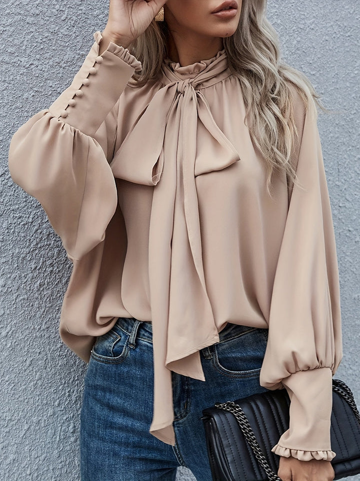 Chic women's long sleeve blouse with tie-neck design for effortless style and comfort.