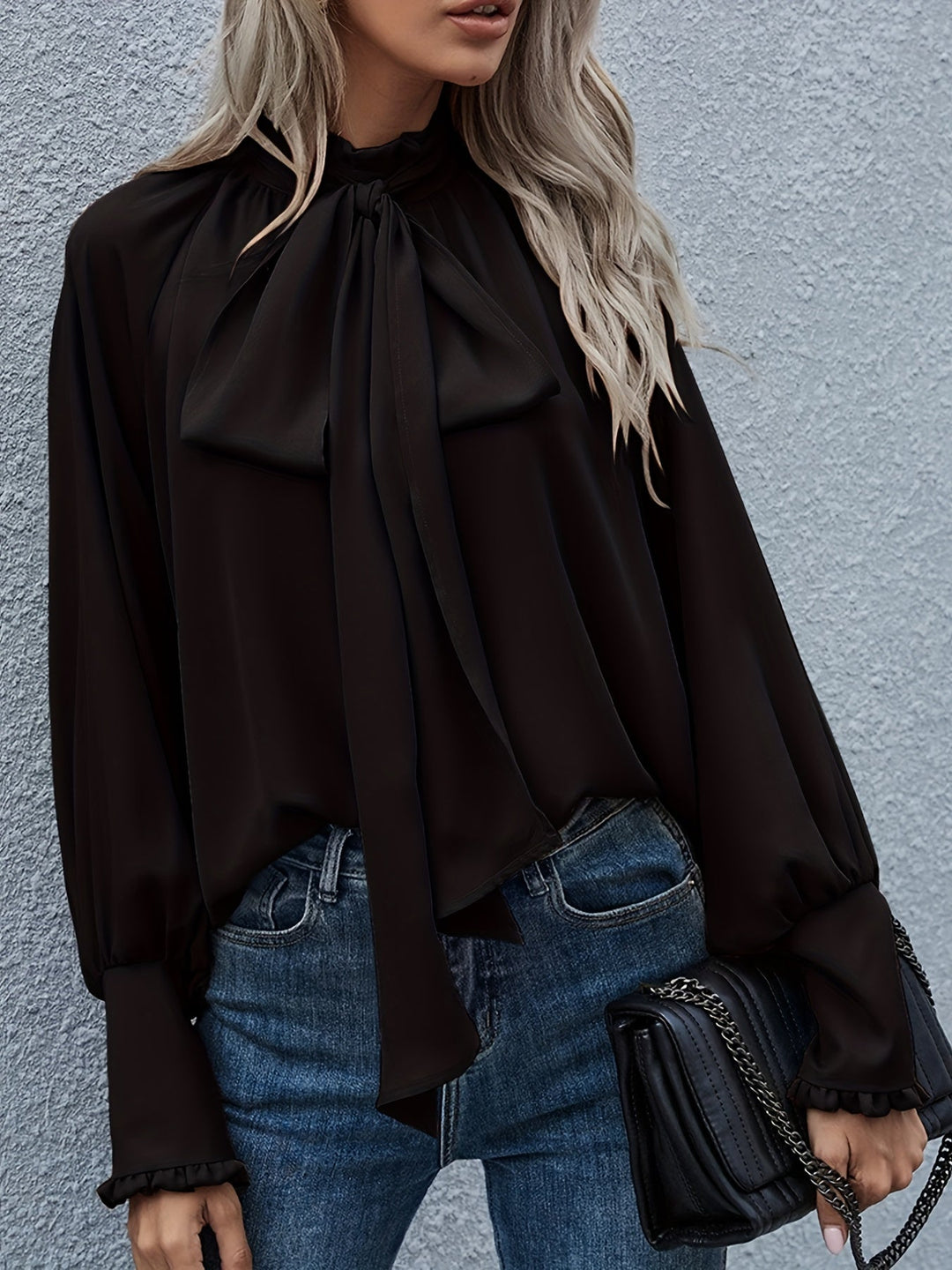 Women's sophisticated tie-neck long sleeve blouse for a polished and professional look.