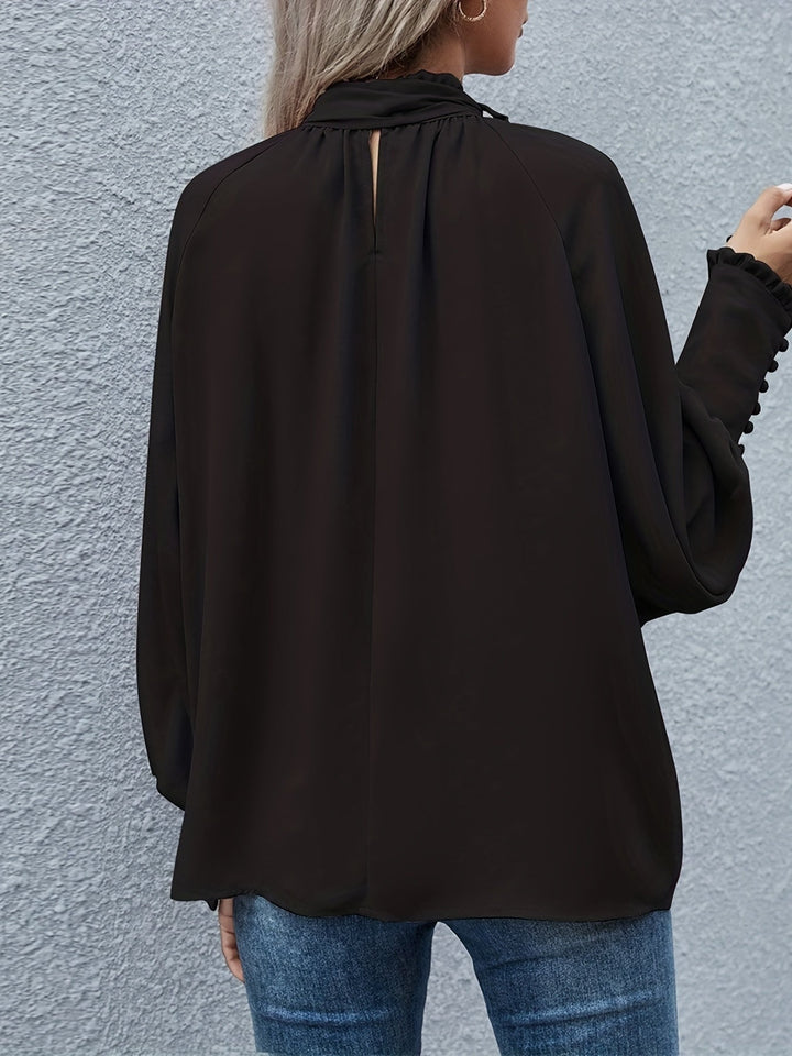 Women's versatile long sleeve tie-neck blouse, great for business or casual outfits.