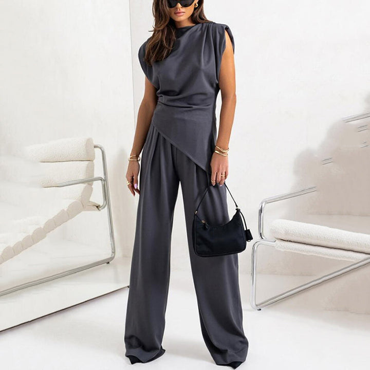 Detail of elegant neckline on women's chic loungewear top. Part of a comfortable two-piece matching set.