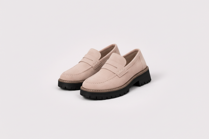 Versatile women's slip-on loafers, black chunky platform design offering comfort and modern style.