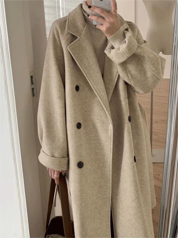 Stylish women's long winter coat featuring a classic design, elegant lapel collar, and flattering belted waist.