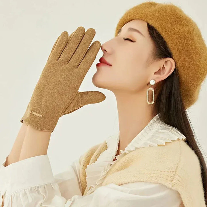 Chic women's suede touchscreen gloves. Protect hands from cold while staying connected outdoors.