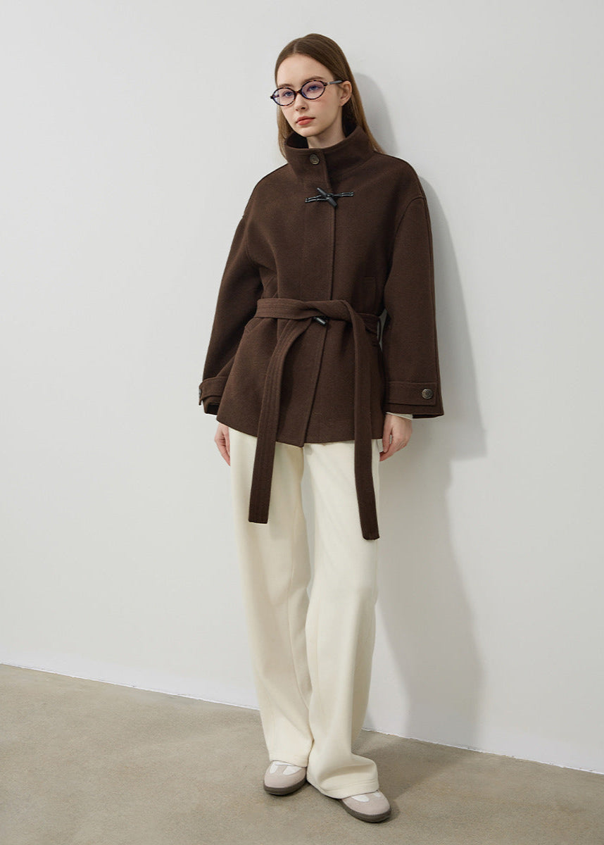 Stylish women's toggle coat featuring a flattering belted waist and classic design, ideal for cold weather.