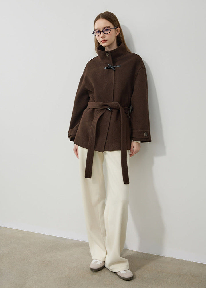 Stylish women's toggle coat featuring a flattering belted waist and classic design, ideal for cold weather.