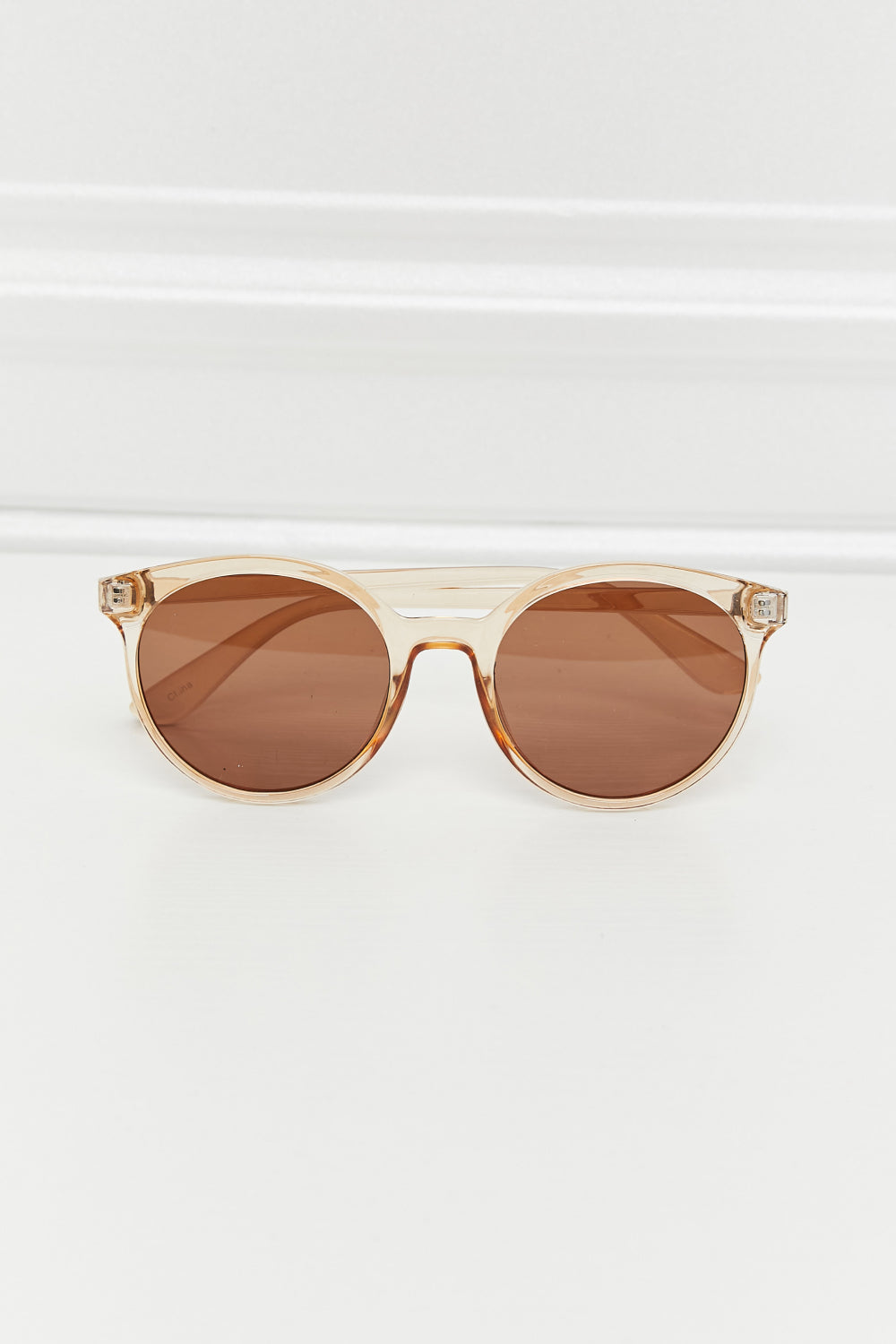 Women's chic round UV400 sunglasses providing essential eye protection with stylish tinted lenses.