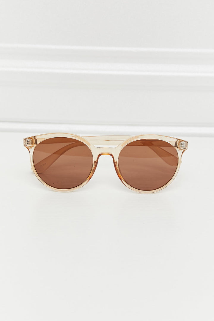 Women's chic round UV400 sunglasses providing essential eye protection with stylish tinted lenses.
