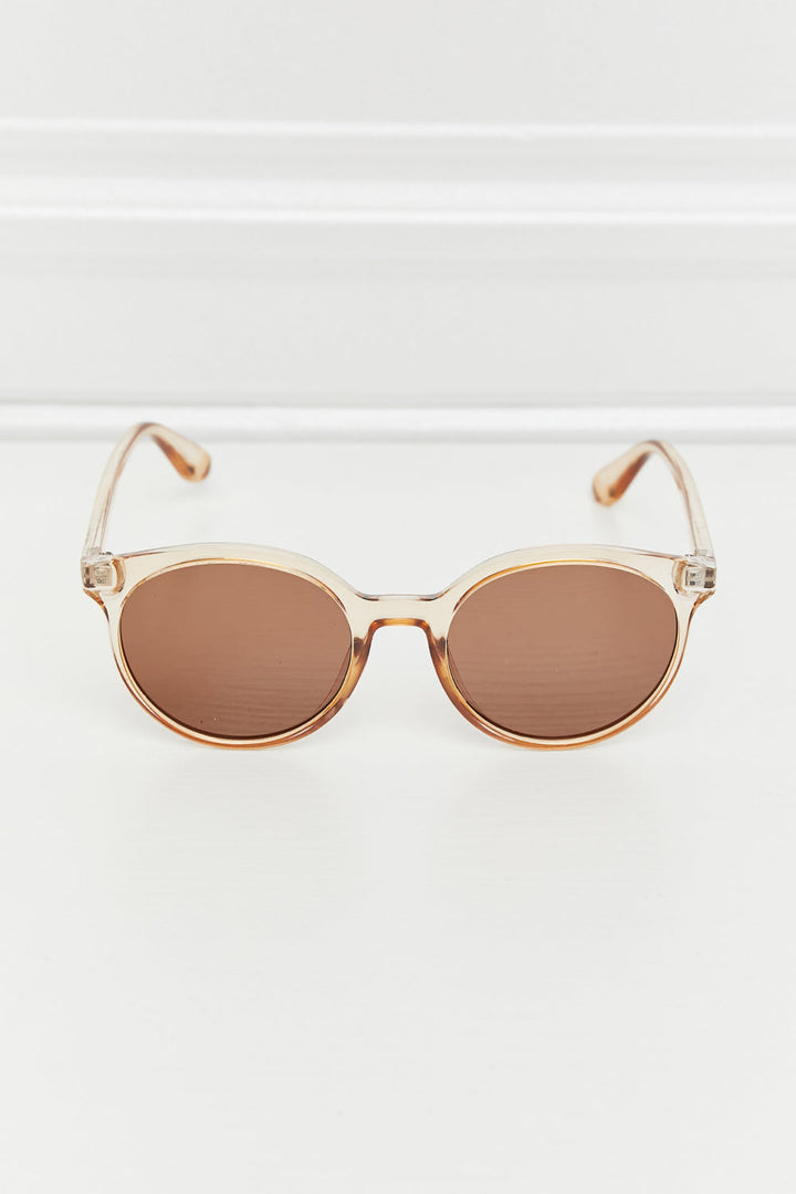 Modern classic women's round UV400 sunglasses; stylish, protective eyewear for fashion-forward women.