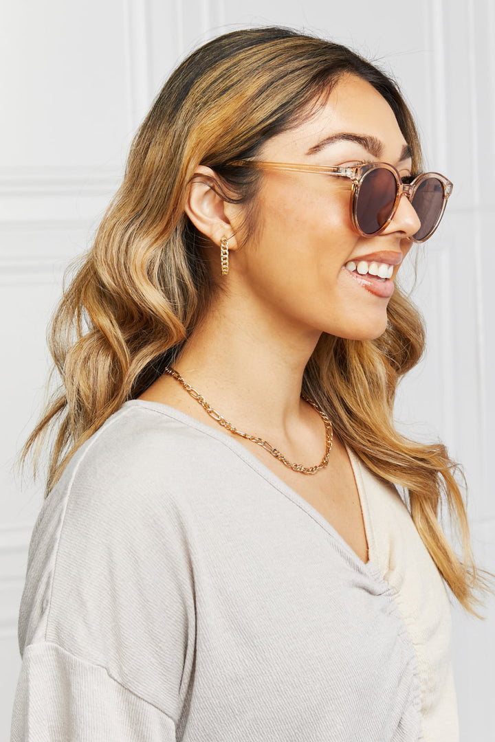 Classic women's round UV400 sunglasses with dark tinted lenses for everyday sun protection.