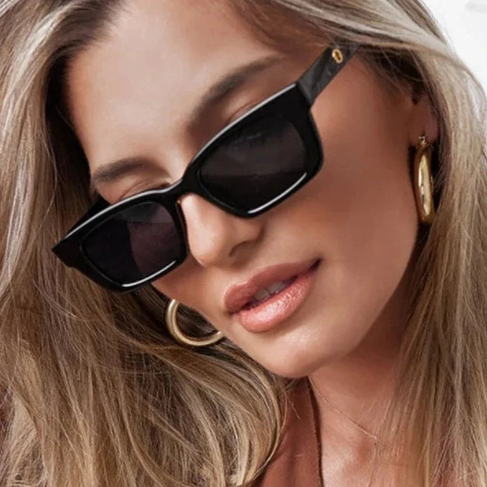 Women's classic wayfarer rectangular sunglasses with dark lenses. Stylish UV protection eyewear for women.