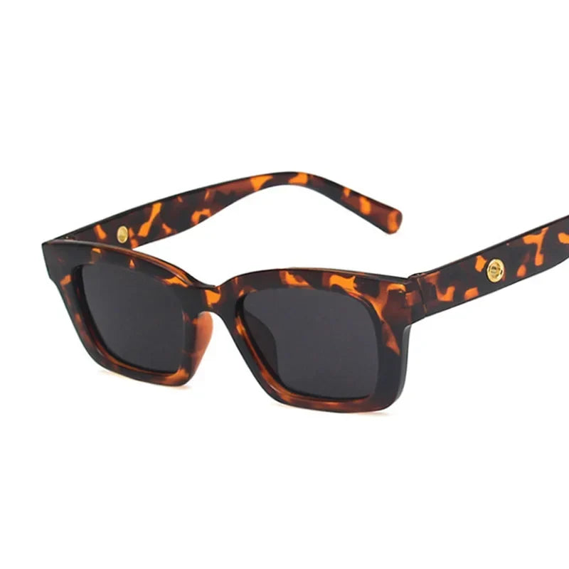 Stylish rectangular wayfarer sunglasses for women. Classic fashion accessory with UV protective dark lenses.
