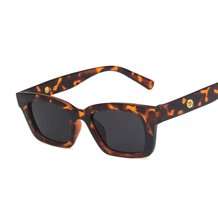 Stylish rectangular wayfarer sunglasses for women. Classic fashion accessory with UV protective dark lenses.
