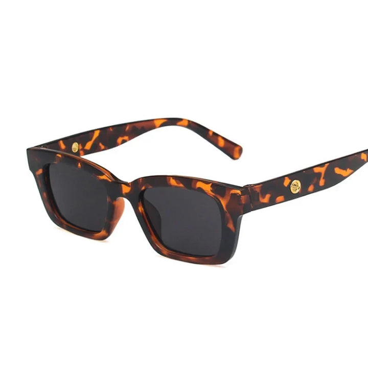 Classic women's wayfarer rectangular sunglasses. Stylish eyewear with dark lenses, offering full UV protection.