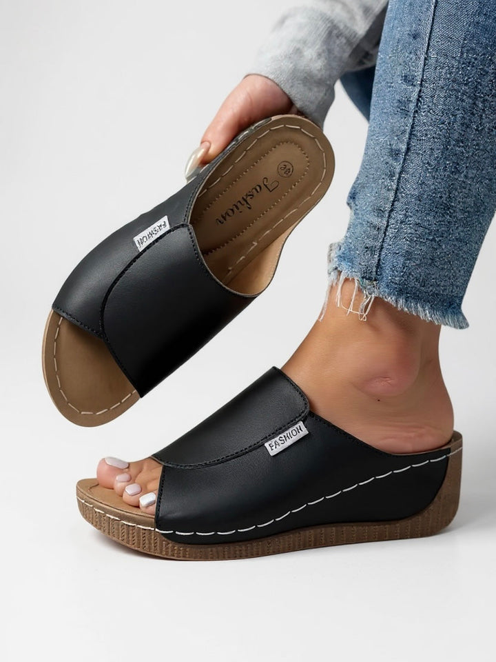 Women's comfort platform slides, ideal for everyday casual wear. Slip-on summer footwear for ultimate ease.