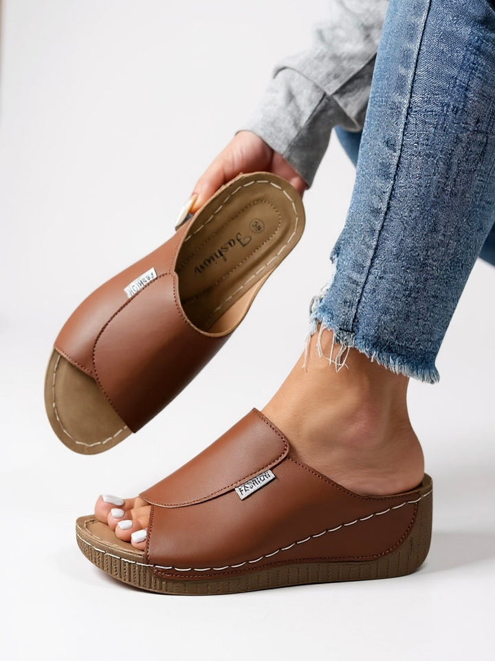 Chic platform slides for women. Comfortable slip-on sandals, perfect casual footwear for summer.