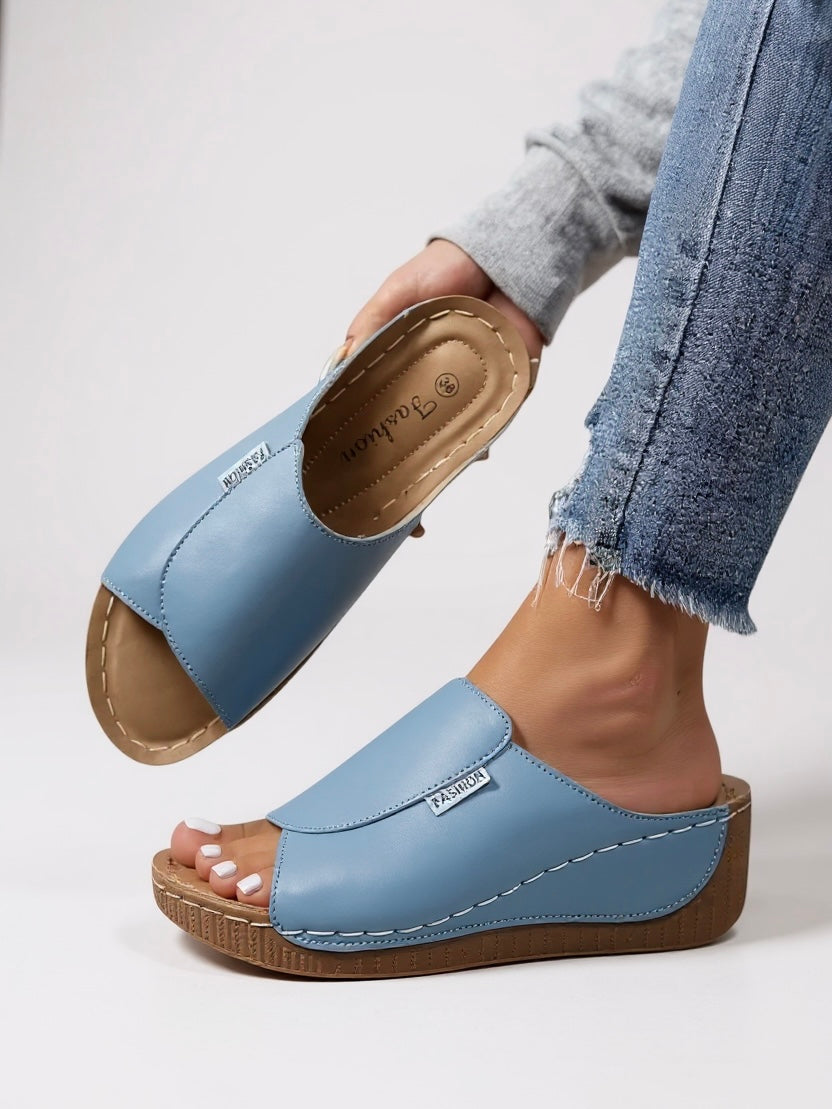 Women's comfort platform slides. Modern, versatile slip-on footwear for an elevated casual summer look.