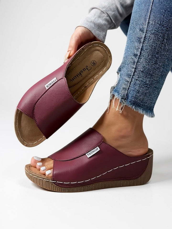 Stylish women's platform slides for summer. Casual comfort footwear with an elevated, modern design.