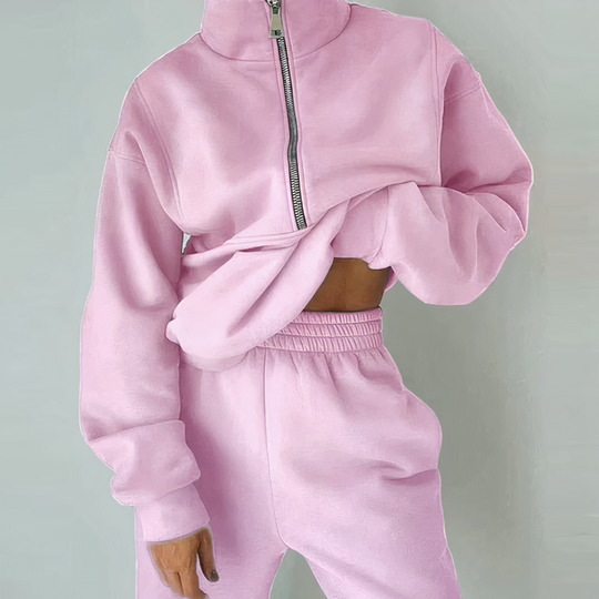 Woman in a stylish activewear set, ready for workout, demonstrating flexibility & comfort.
