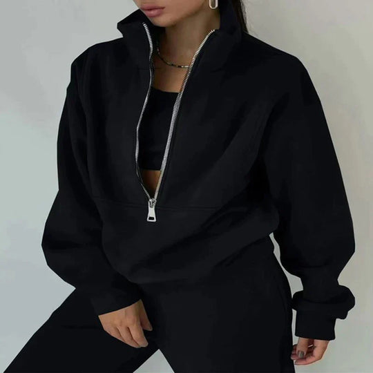 Blue women's fitness apparel, a cozy two-piece jogger and hoodie set for active women.