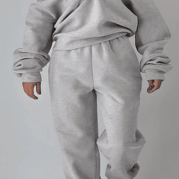 Front view: Women's cozy 2-piece sports suit, featuring a comfortable top & matching jogger pants.