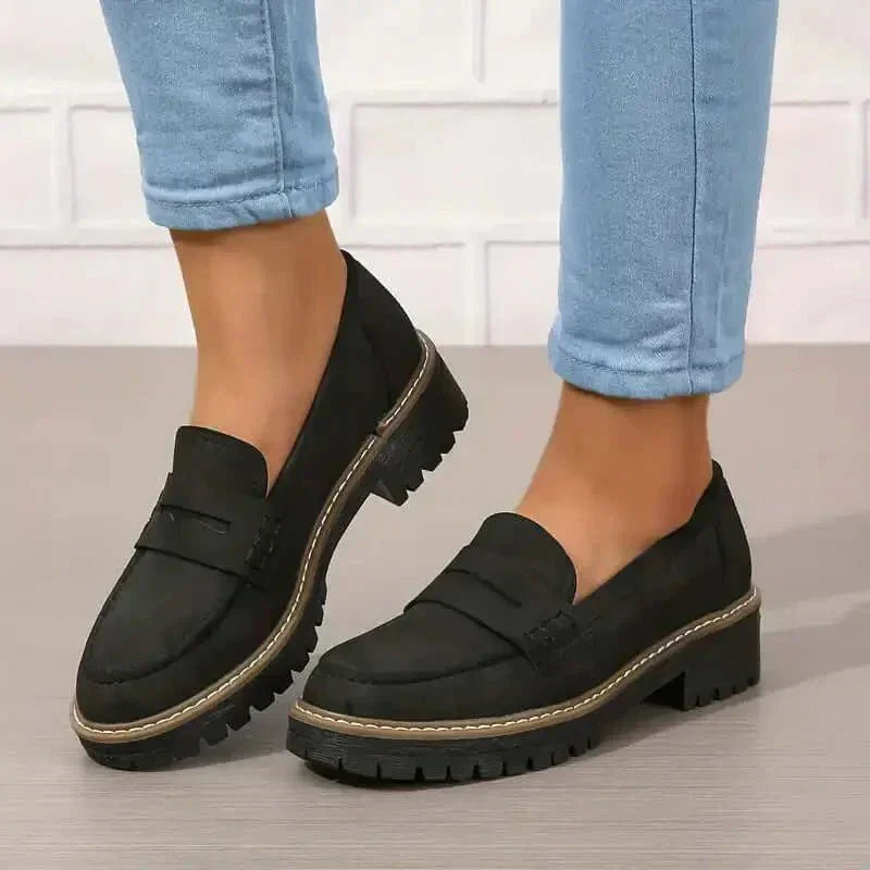 Black chunky loafers for women, a comfortable and stylish slip-on shoe perfect for everyday and autumn outfits.