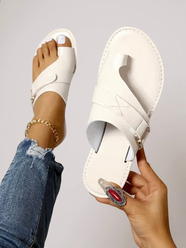 Chic white women's toe-loop slides with a comfortable sole, ideal for summer beach days & casual elegant style.