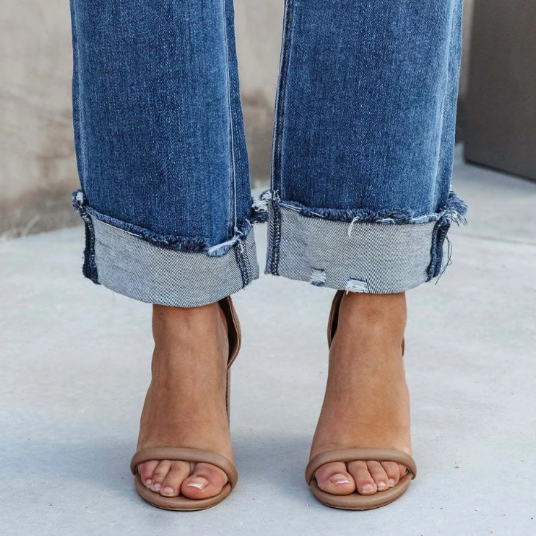 Soft, comfortable high-waisted relaxed fit women's jeans in a classic wash, ideal for casual everyday fashion.