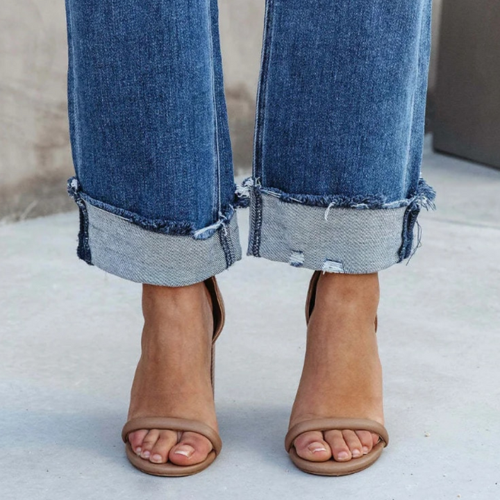 Soft, comfortable high-waisted relaxed fit women's jeans in a classic wash, ideal for casual everyday fashion.