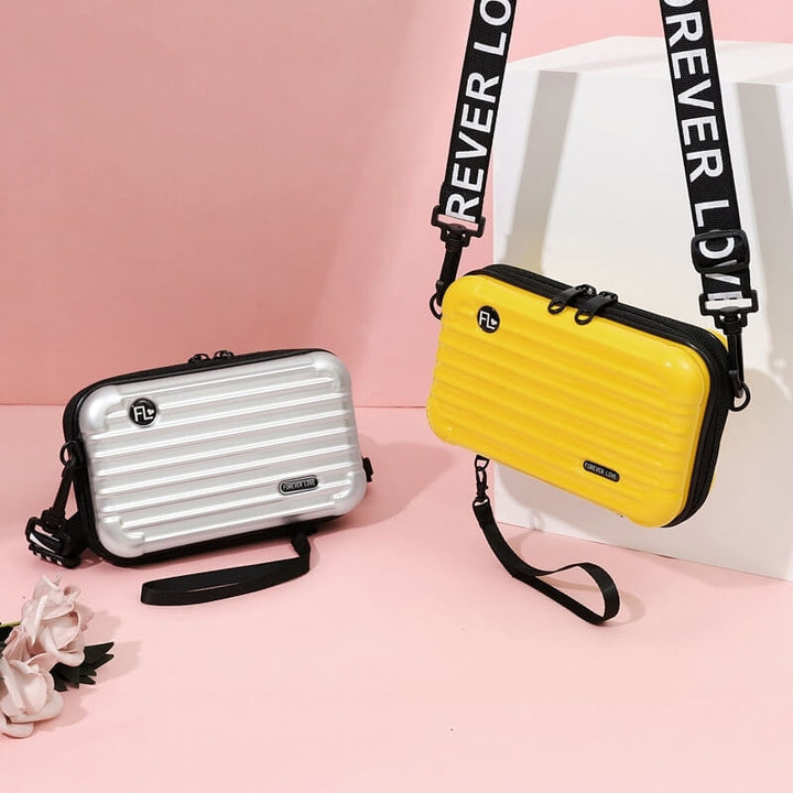 Stylish women's hard shell travel crossbody bag, compact & durable for essentials.