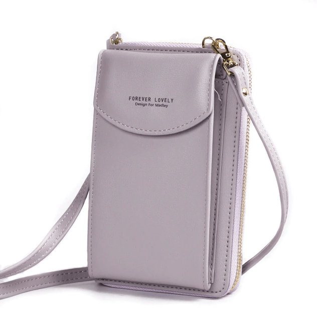 Detail of the secure closure on a women's compact PU leather crossbody bag.