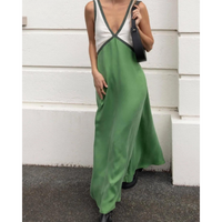 Flowing women's maxi dress with elegant contrast details and flattering V-neckline.