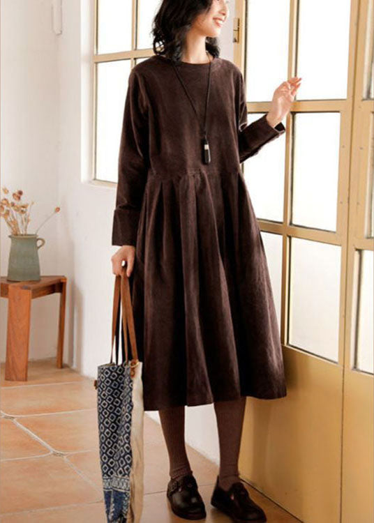Elegant women's autumn winter corduroy midi dress. Sophisticated long-sleeve style for comfortable casual wear.