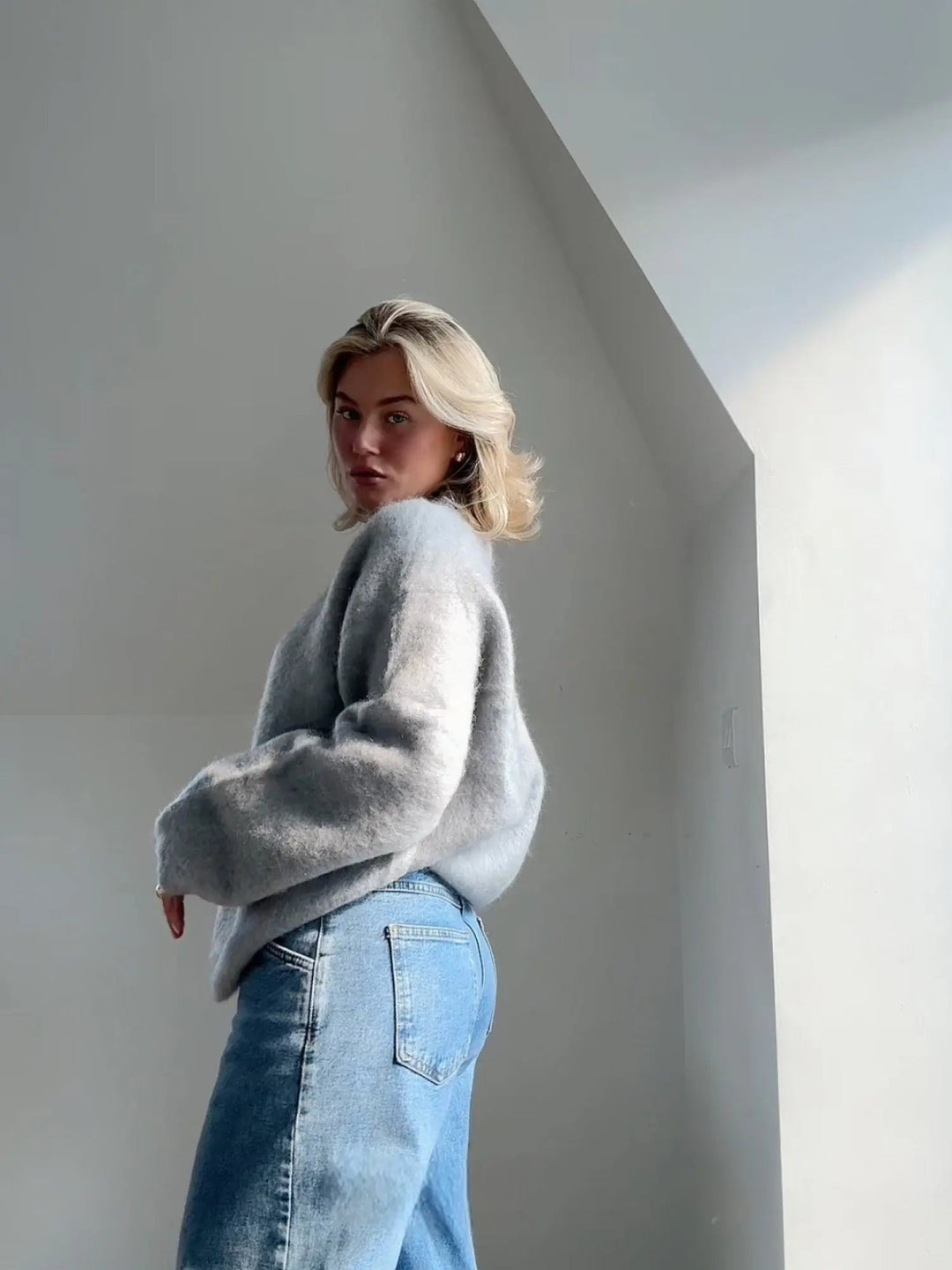 Fall/winter women's textured knit sweater, cozy, elegant, and versatile for casual chic layering.