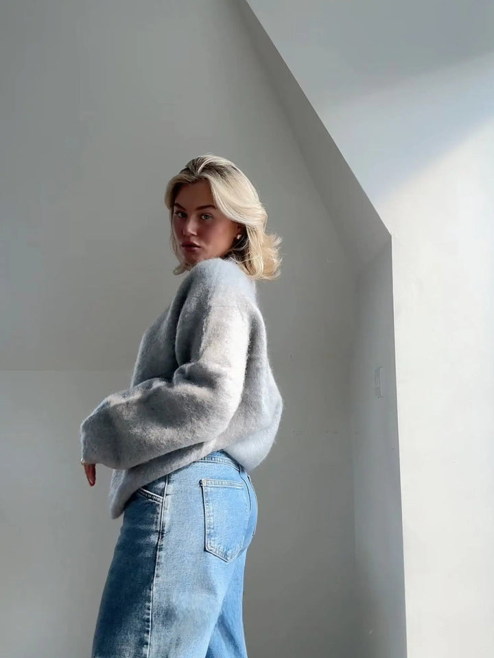 Fall/winter women's textured knit sweater, cozy, elegant, and versatile for casual chic layering.