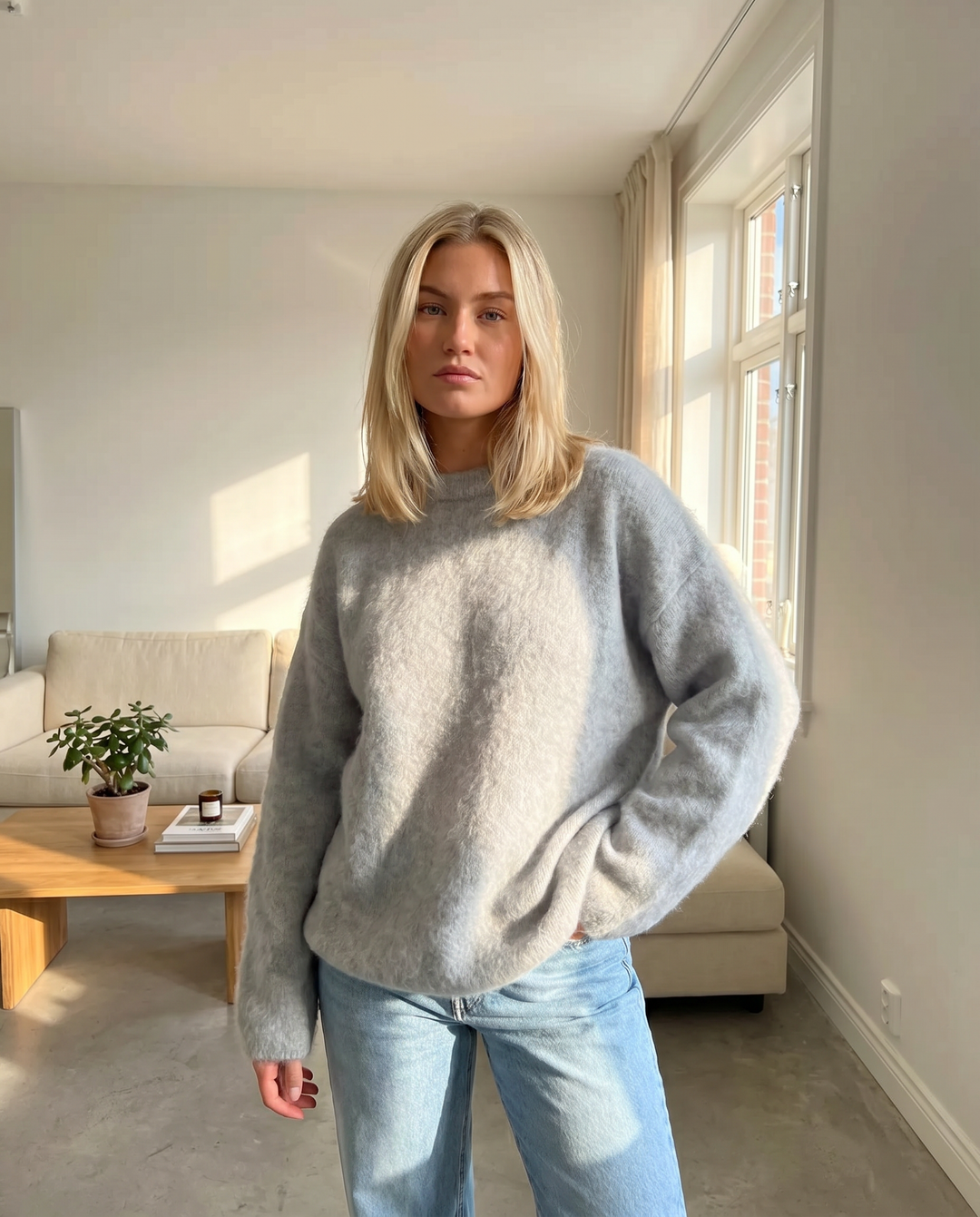 Soft textured knit women's sweater, cozy and elegant, with a relaxed fit for versatile fall fashion.