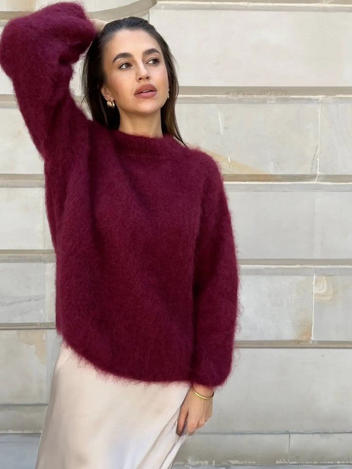 Chic women's textured knit pullover with long sleeves, offering cozy comfort and elegant style.