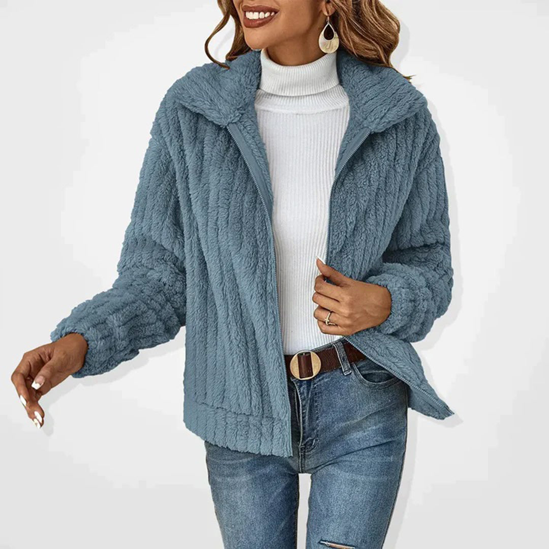 Stylish women's Ember fleece vest, ideal for layering warmth over tops. Cozy fashion outerwear for comfort.