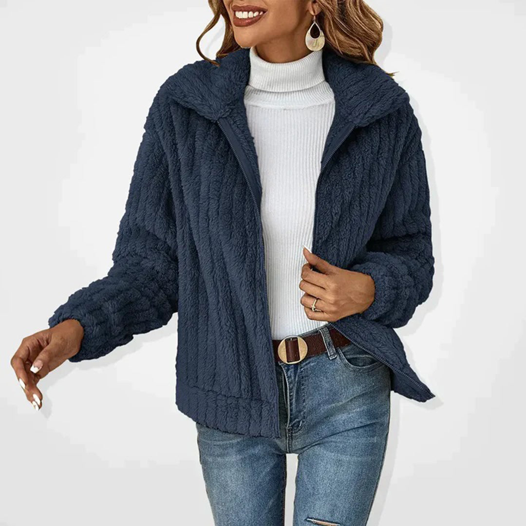 Versatile women's Ember vest, a cozy fleece layer offering warmth and style for outdoor activities.