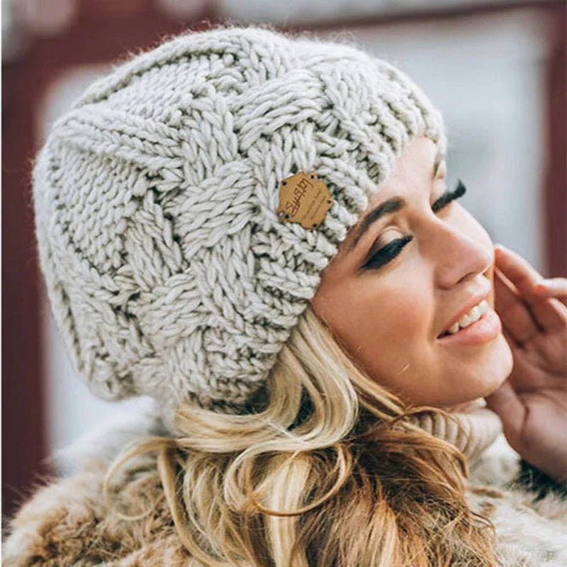 Women's cozy knitted beanie hat, soft & warm winter fashion accessory.