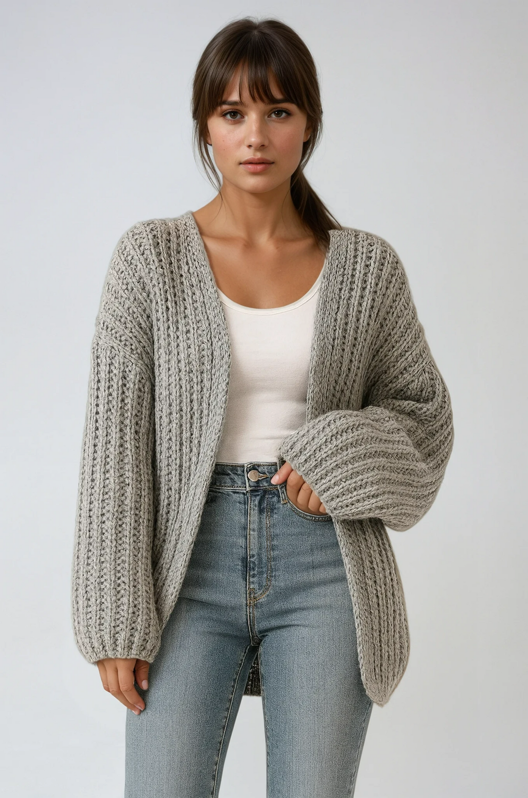 Women's cozy oversized knit cardigan with lantern sleeves, perfect for fall layering.